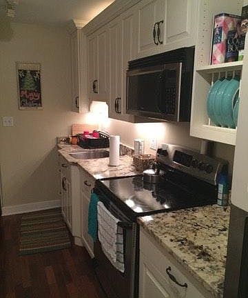 Kitchen - Custom Cabinets, Track Lighting, Top of the Line Appliances