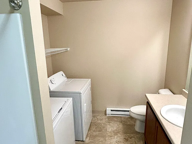 Secondary bathroom with laundry