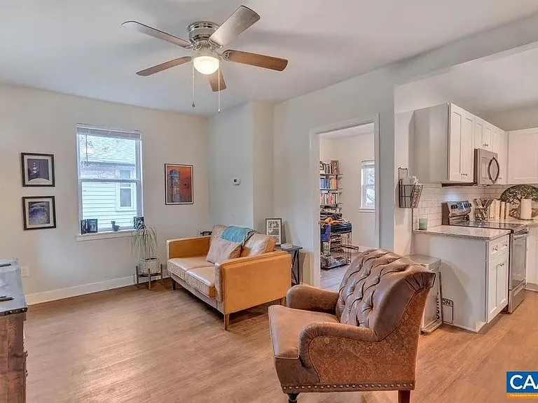 Open living room/kitchen area. 2nd bedroom pictured.