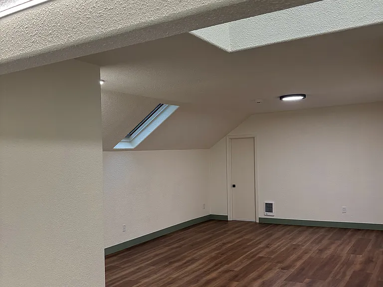 Standing in kitchen, viewing main living area.