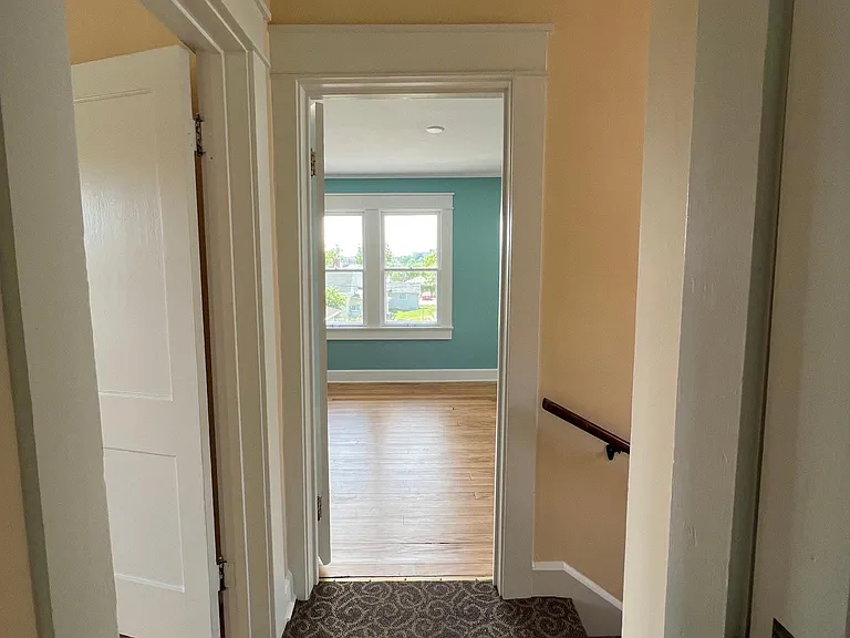 view from upstairs hall looking into front bedroom