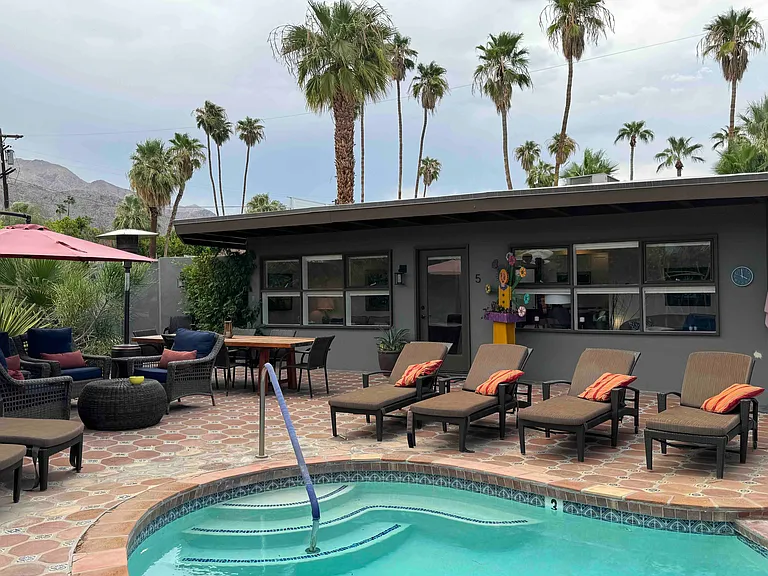 Unit 5 - the fully furnished owner's unit is the end-unit, widest in comples with 6 pairs of windows and a glass door. Direct access to pool, grill, dining and parking.