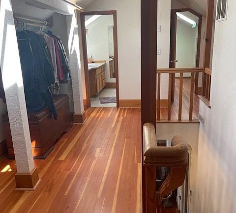 Hallway with double-wide clothes area.