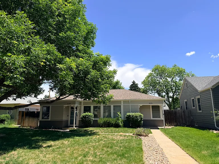 2646 S Marion is a duplex unit on a quiet, tree lined street in an established neighborhood with a nice mix of young families and longtime residents. There is a covered front porch with room for a small swing or outdoor sofa.