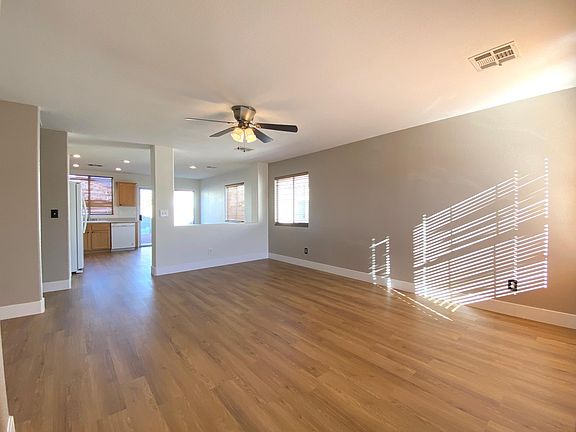 Entrance to open floor plan living room, kitchen and dining area.
