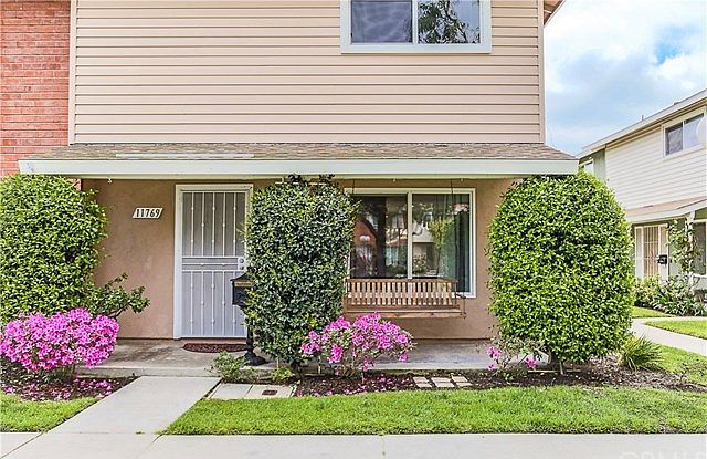 Nice end unit, with a front porch and swing