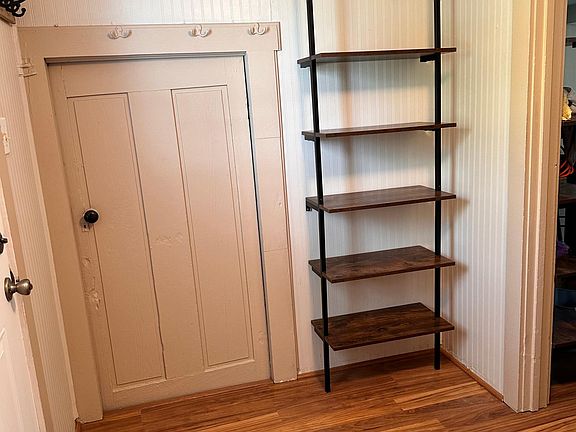 Back door entrance into laundry room and door to cellar