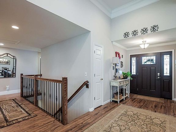 OWNERS JUST HAD THIS GORGEOUS CRAFTSMAN STAIR RAIL INSTALLED WITH IRON BALLISTERS.