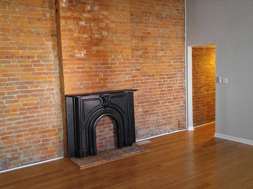 Living room with exposed brick.