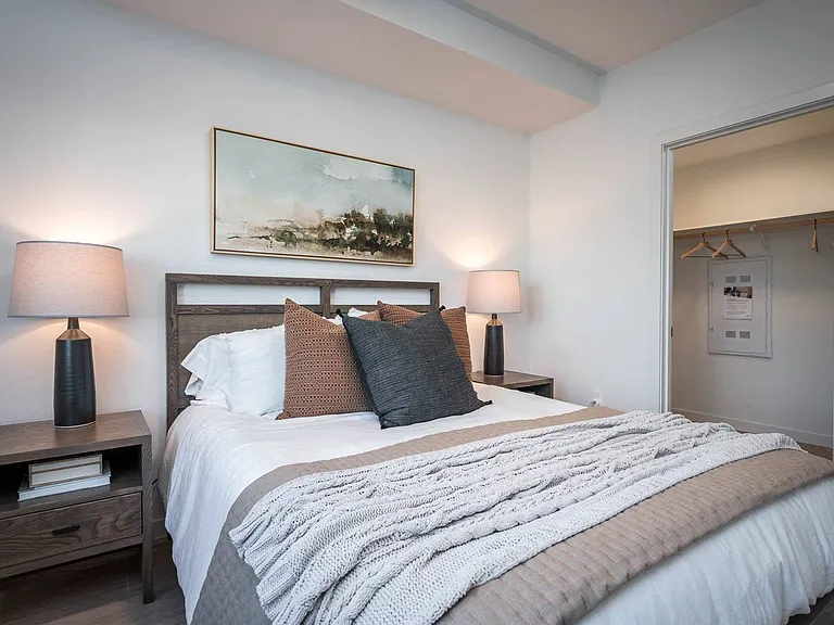 The Byway | Model #105 Beautiful Primary Bedroom Shown With Queen Sized Bed and Two Nightstands