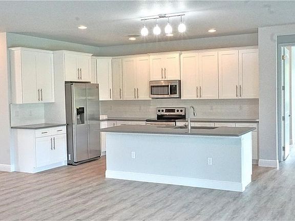 42 in soft close cabinets, subway tile backsplash, stainless pulls, Samsung Appliance package and Quartz counters