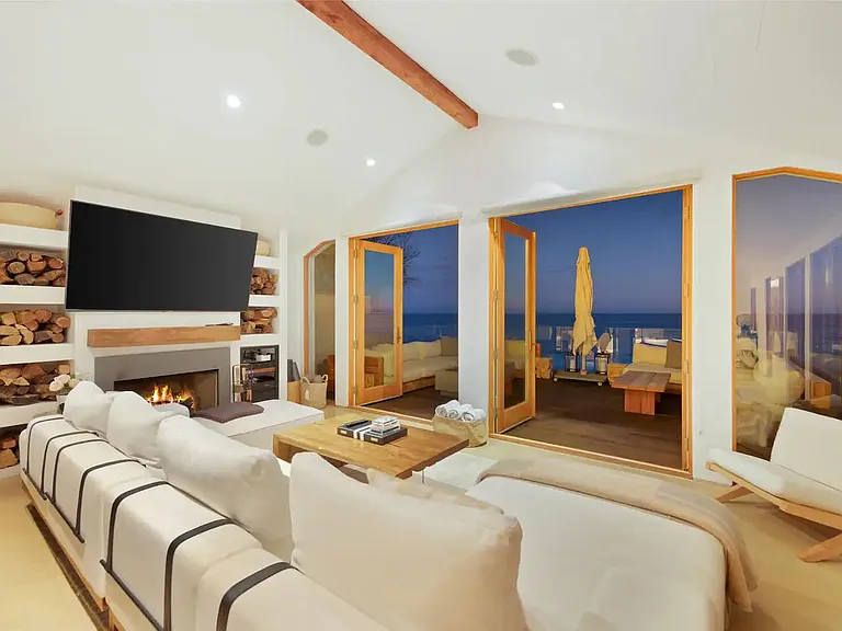 Let the evening ocean breeze cool the living room on a summer night.