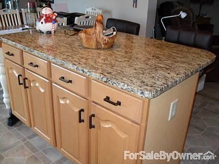 Island with granite countertop