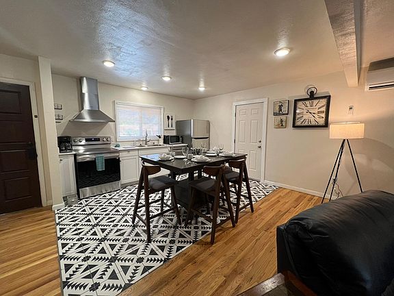 Open concept living in dining area when it previously had counter height dining set