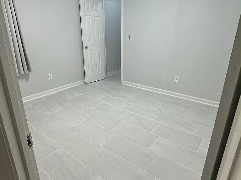 Beautifully renovated second bedroom featuring brand-new flooring and generous closet space. Located in a spacious 4-bedroom, 3-full-bath home with numerous updates throughout.