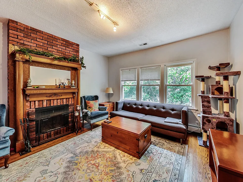Living room with functioning wood fire place