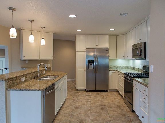 Recently Remodeled Kitchen with Stainless Steel Appliances and Granite Countertops