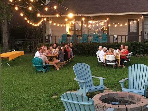 fire pit with chairs and night lighting