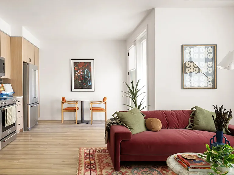 Open-concept living with light wood cabinetry, stainless steel appliances, and space to dine, unwind, and entertain with ease.