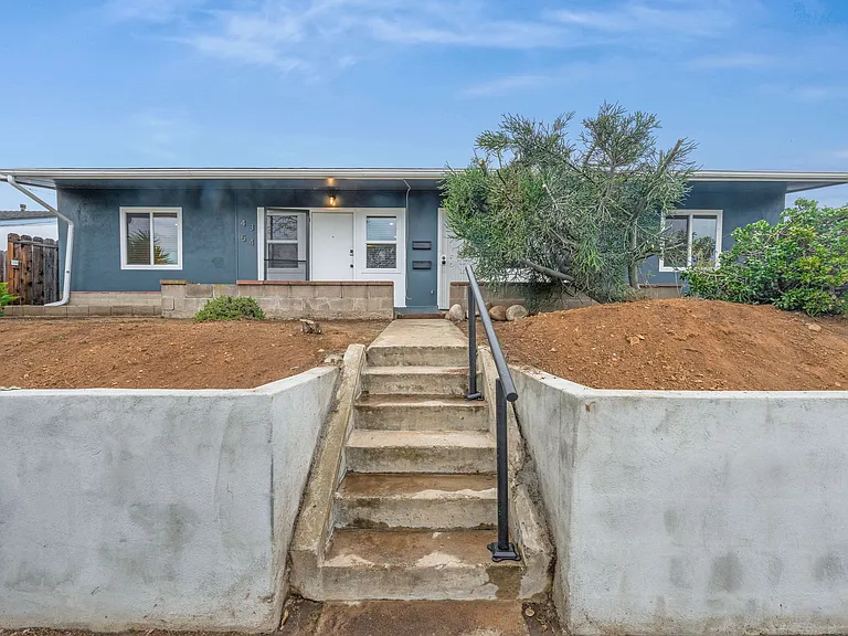 The backyard is connected to the private driveway that can fit up to 2 cars.