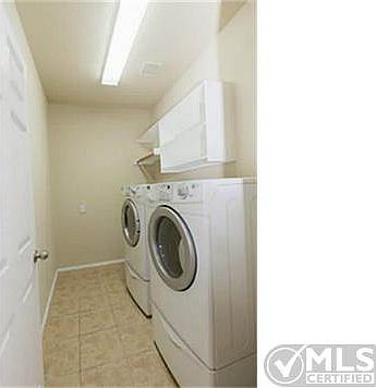 A good sized laundry area even has room for a small folding tabl