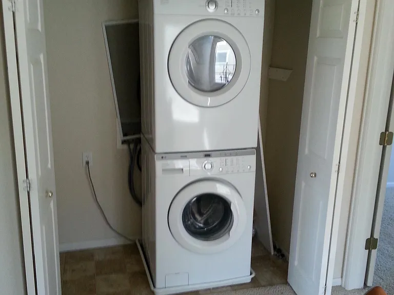 Laundry area conveniently located upstairs with all the bedrooms. NOTE: Washing machine has been replaced with a new top-loader.