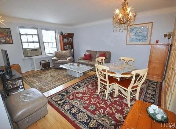 Large bright living room overlooks the courtyard and has refinished hardwood floors.  There are French doors that open to a dining room that is currently being used as a second bedroom.  The room is 18'-0" x 14'-2"