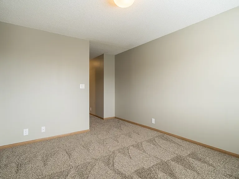 Retreat to your quiet, comfortable bedroom with soft carpeting, natural light, and plenty of space to make it your own.
