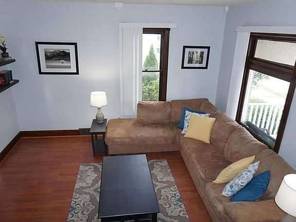 Living room is spacious in size as well as ceiling height. Original trim in this room offers charact