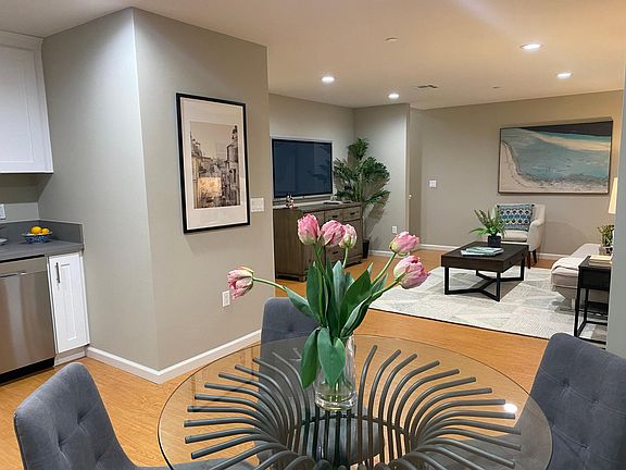 Open Concept with a powder room off the left along with access to attached garage.