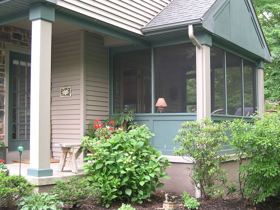 Front Porch and Screened Porch Facing Woods