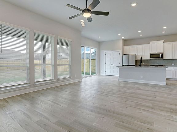 Spacious layout with a large family room overlooking the covered patio.