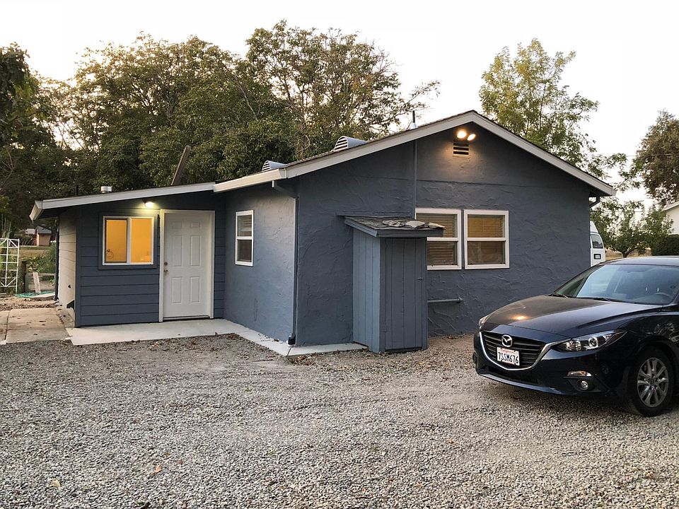Back porch showing rear entry door opening to utility room and bath
