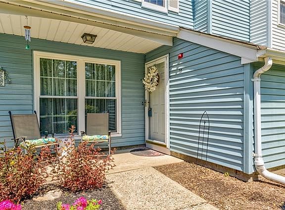 Covered porch sitting area.