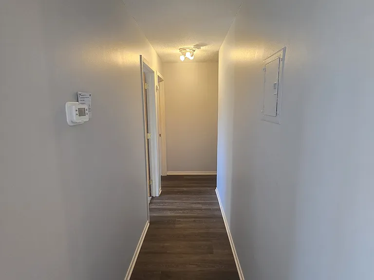 Hallway to bedrooms and bathroom. New thermostat allow you to stay comfortable year-round.