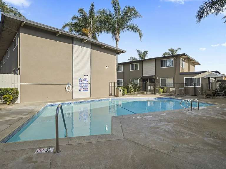Community swimming pool at Olive Tree Townhomes in Costa Mesa, CA