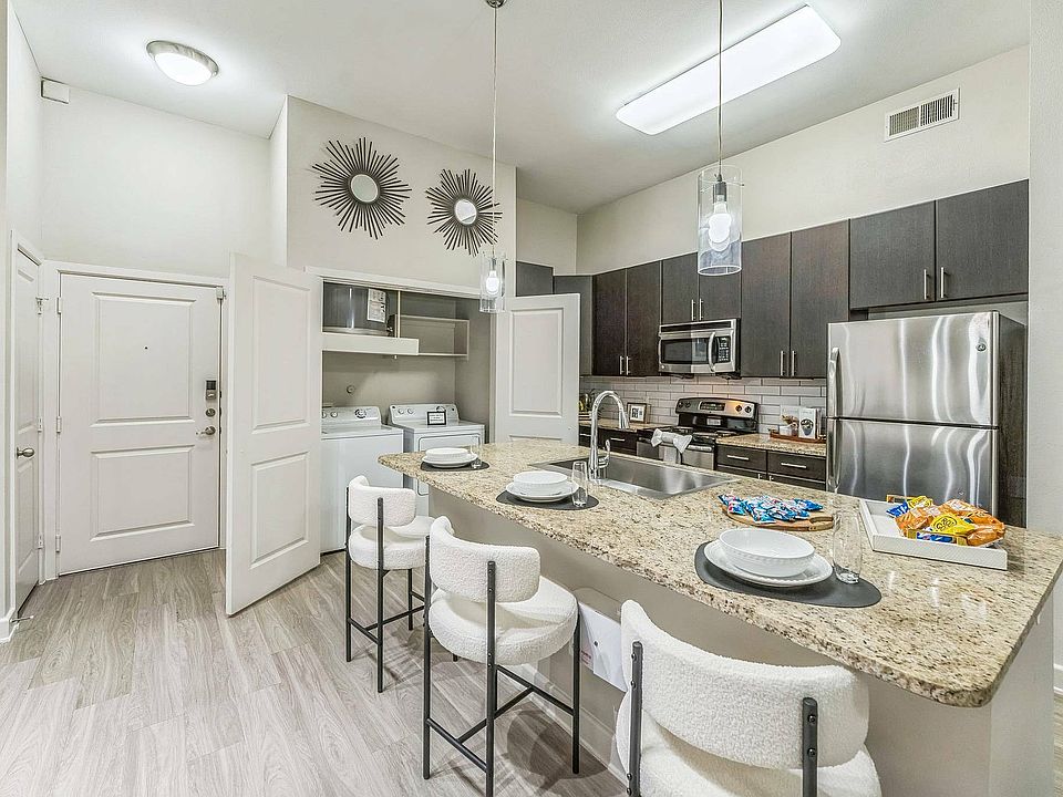 Experience modern living with a stylish kitchen at Addison Keller Springs
