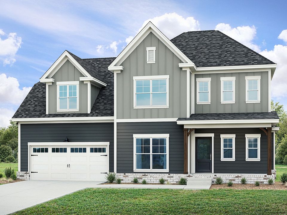 Experience luxury with gabled rooflines and sleek grey siding at Richvale Estates.
