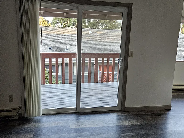 Open sliding door leading to back porch