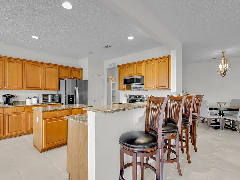 large open kitchen area open to great room, dining and kitchenette