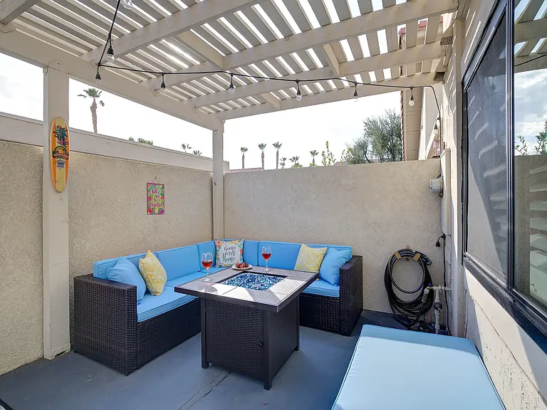 Back Patio sectional -- propane fire pit and lights. Perfect for night-time entertaining.