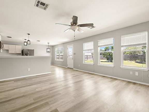Living room that's overlooking the kitchen; no carpets!