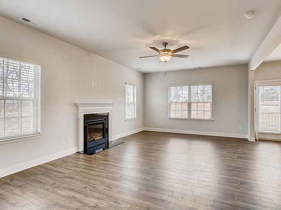 Large open living room with gas fireplace.