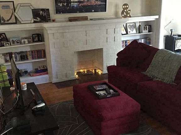 Spacious living room with beautiful, inactive fireplace