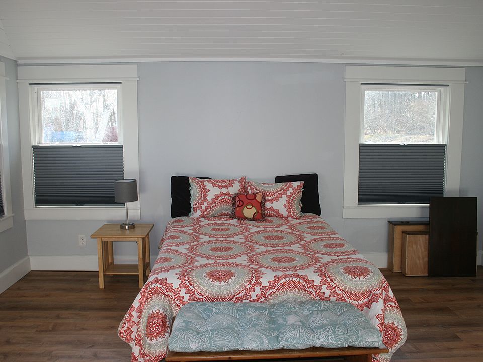 New queen-sized bed, linens provided. Bedroom has plenty of natural light and shades that pull down from top or up from the bottom