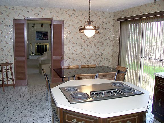 Kitchen with view of den.