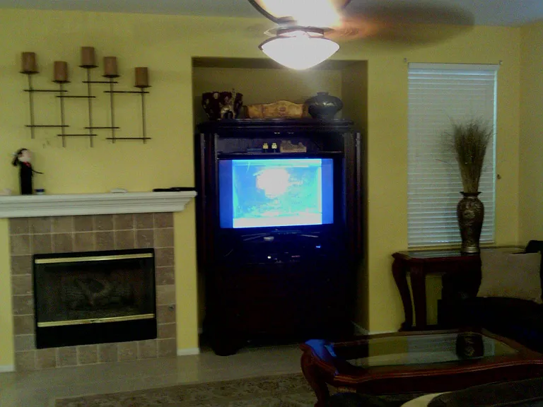 Family Room decorated and with previous gold wall paint