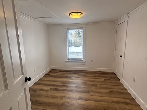 First bedroom, smaller room with a good size closet. Across from the bathroom