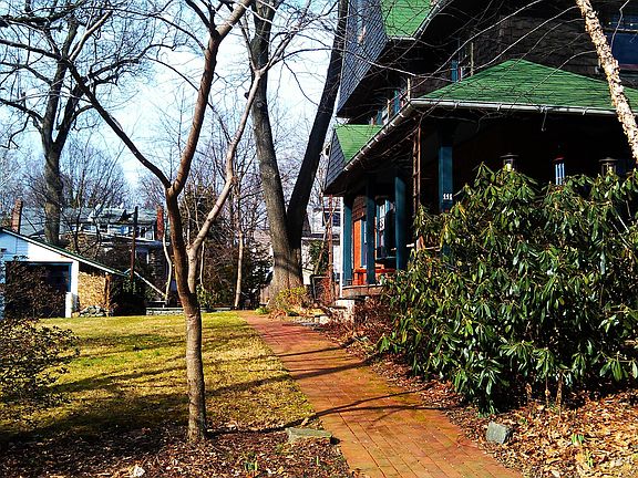 Exterior from street with yard and garage to the left
