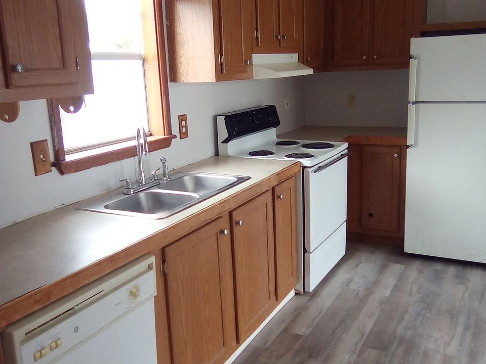Kitchen with nice cabinet plus appliances